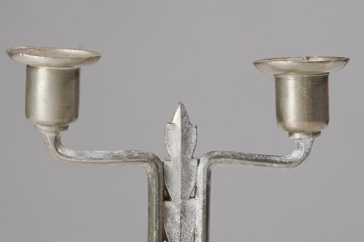 Candlestick made of tin with two spots for candles.