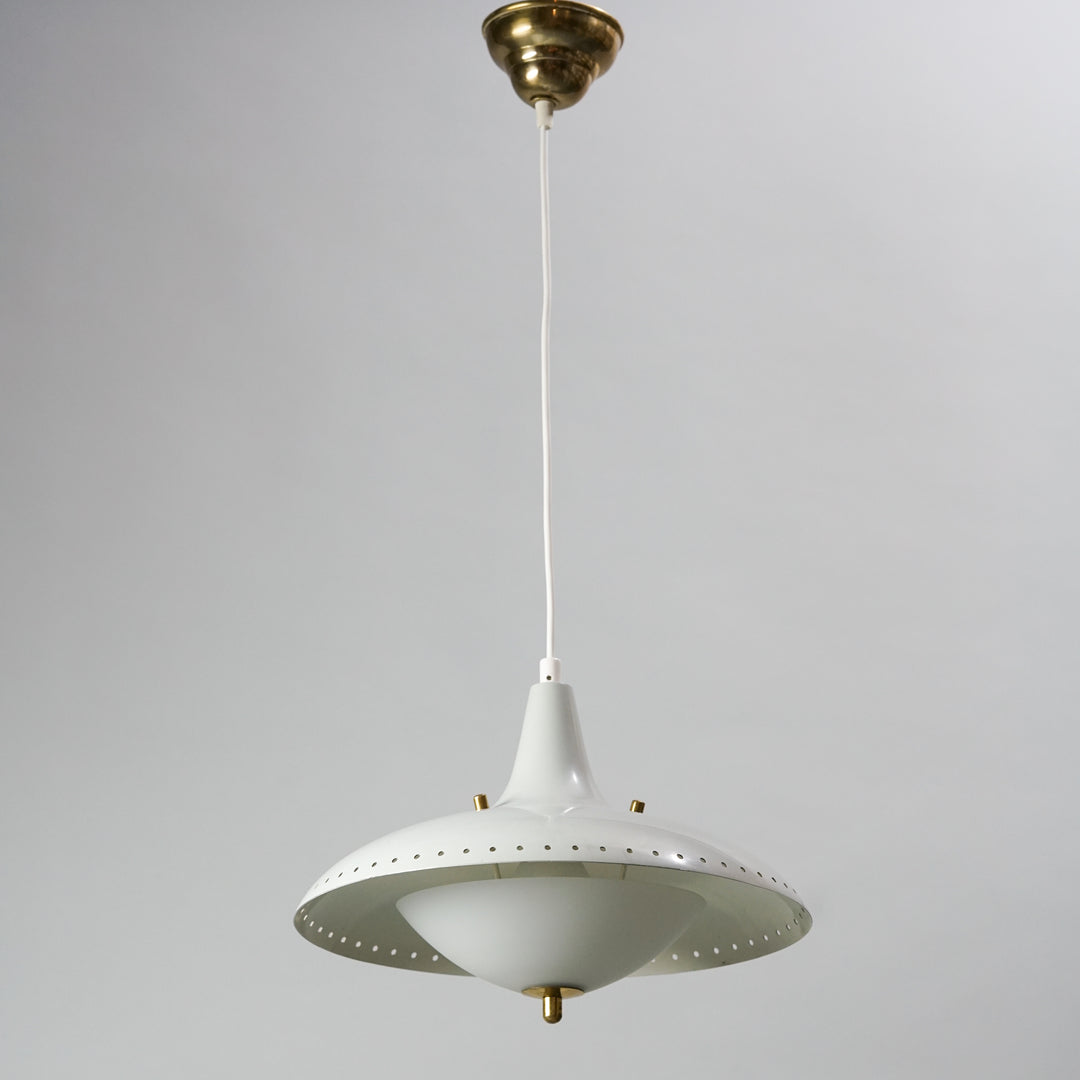 A lamp made with white painted metal, that has brass detailing. The dome of the lamp is made of white glass.