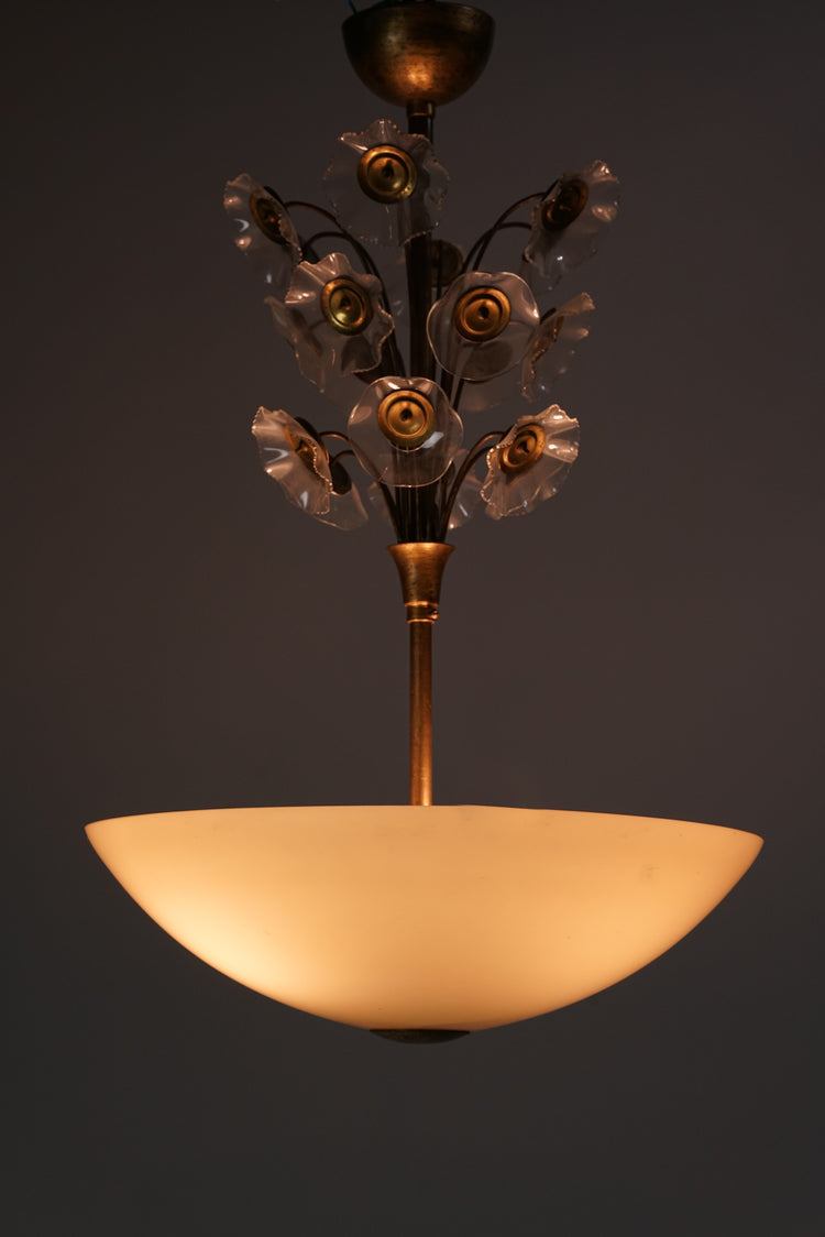 Chandelier with cream colored glass dome and brass frame.  Bright glass flowers decorate the frame.