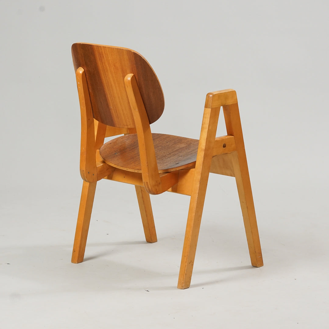Wooden chair with a darker seat and backrest. The armrests are "A" - shape.