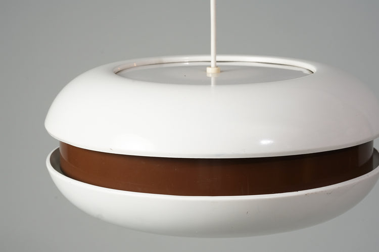 Four identical ceiling lights. Round shape. White plastic body with brown plastic centre. 