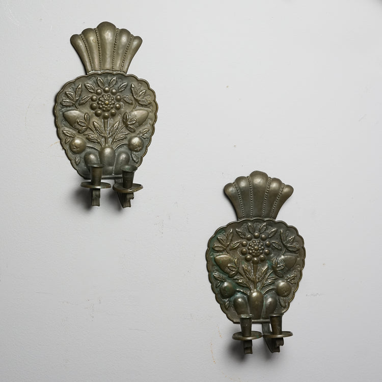 Two identical wall sconces made of brass in a shape of a raspberry. The sconces have flower patterns and two holders for either candles or lamps.