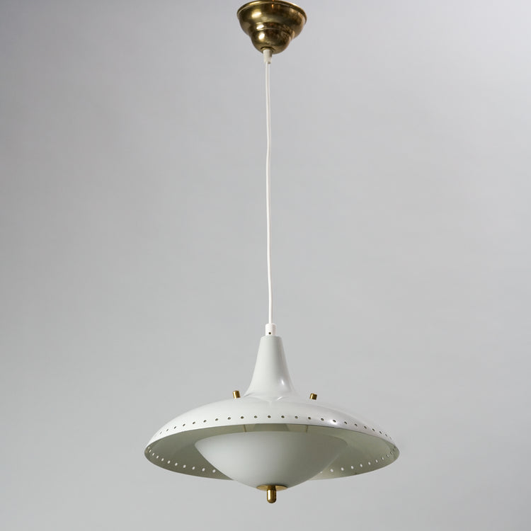 A lamp made with white painted metal, that has brass detailing. The dome of the lamp is made of white glass. 