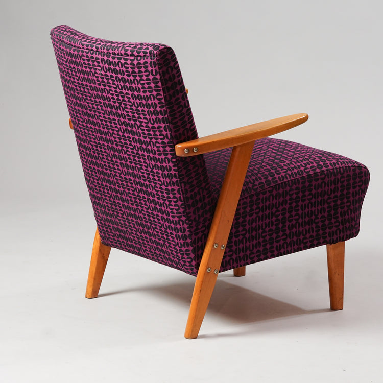 Birch frame armchair upholstered in a patterned fabric that is black and purple in color.