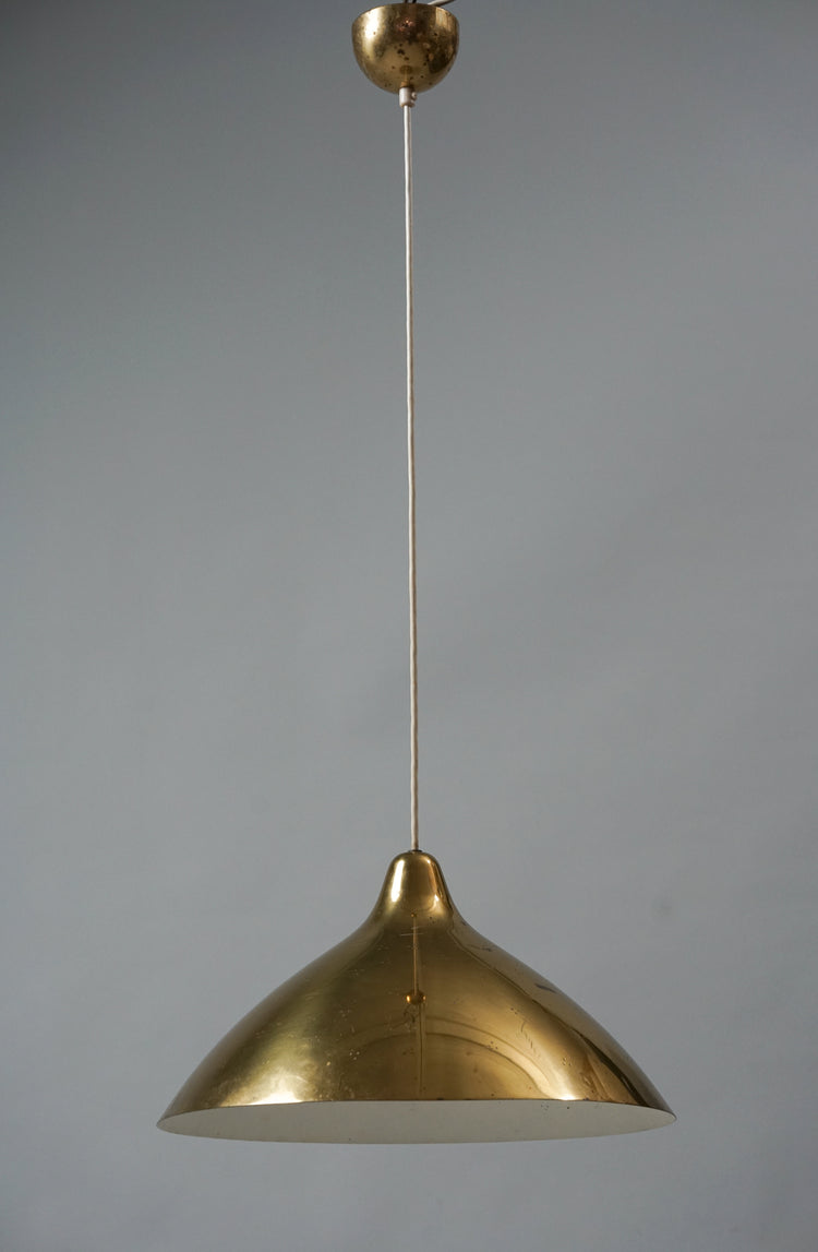 Brass lamp which gets wider at the bottom.