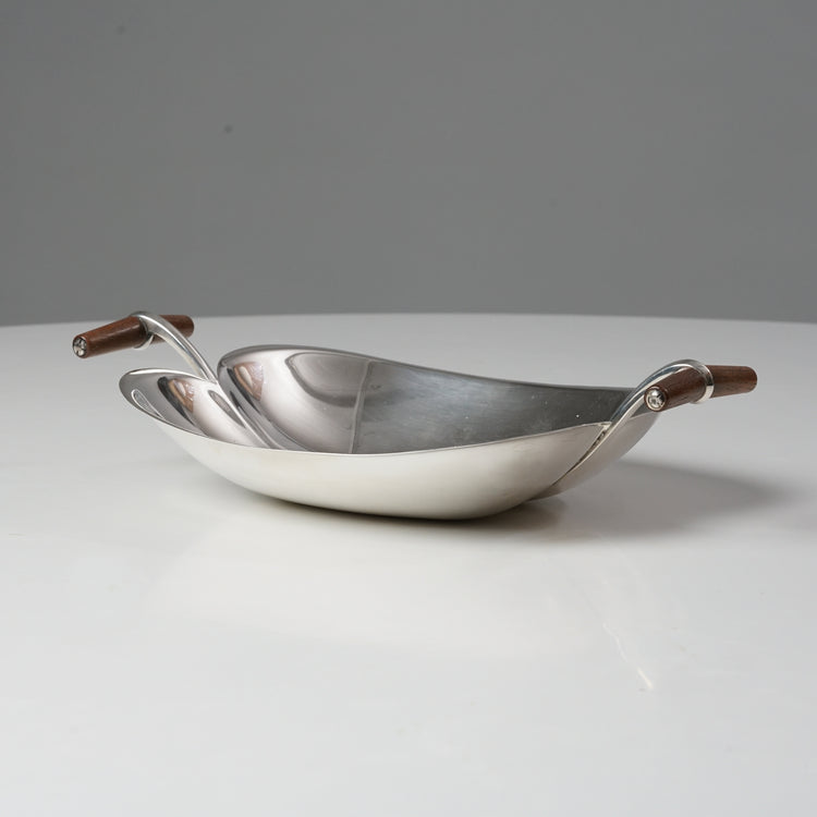 Wide silver bowl with two wooden handles.