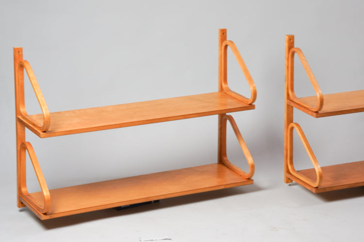 Two identical wall shelves. Shelves are made of birch and have two levels.