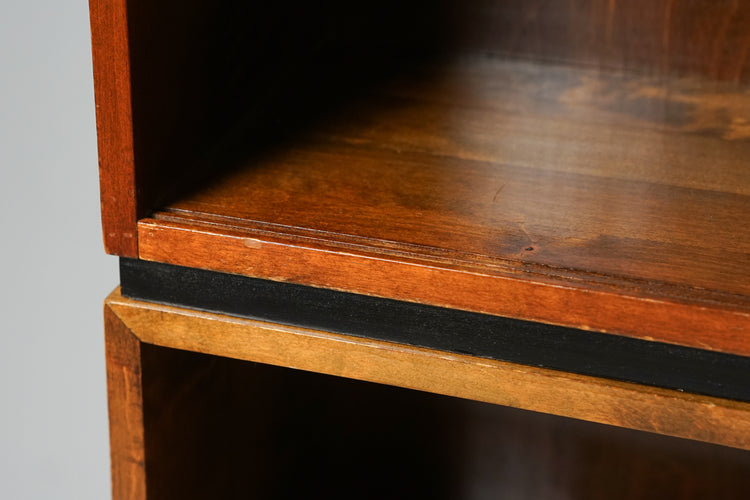 Three closed back shelves that can be stacked. Made of birch, medium wood color.