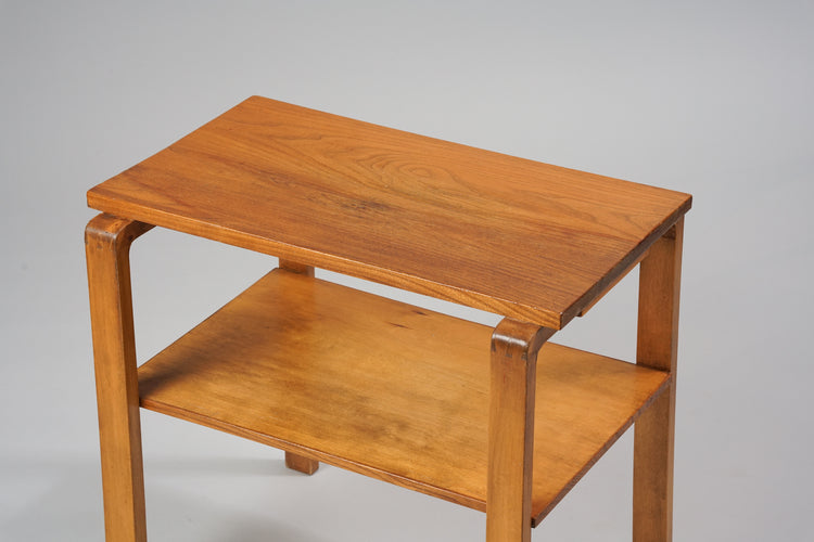 A side table made of elm and birch, with on shelf below the top.