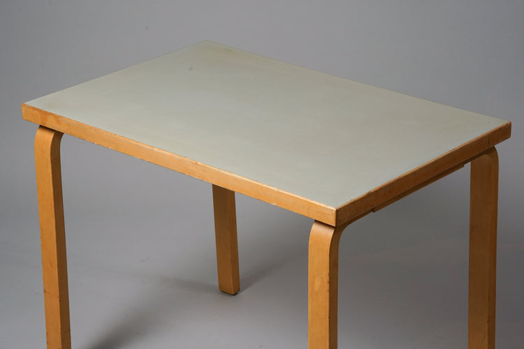 Table made of birch with a greenish grey tabletop.