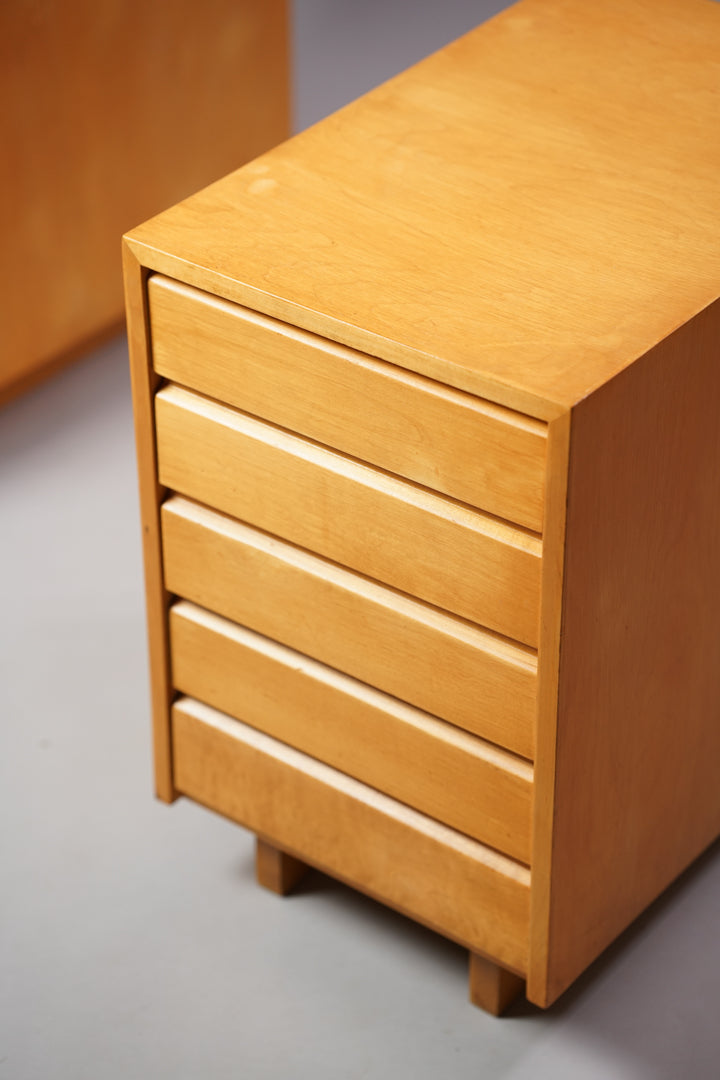 Two different kinds of chest of drawers. First one has five drawers of the same size. Other has four same size drawers and one bigger. Both made or birch.