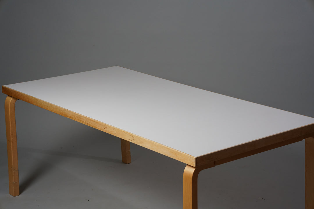 Table made out of birch with a white tabletop.