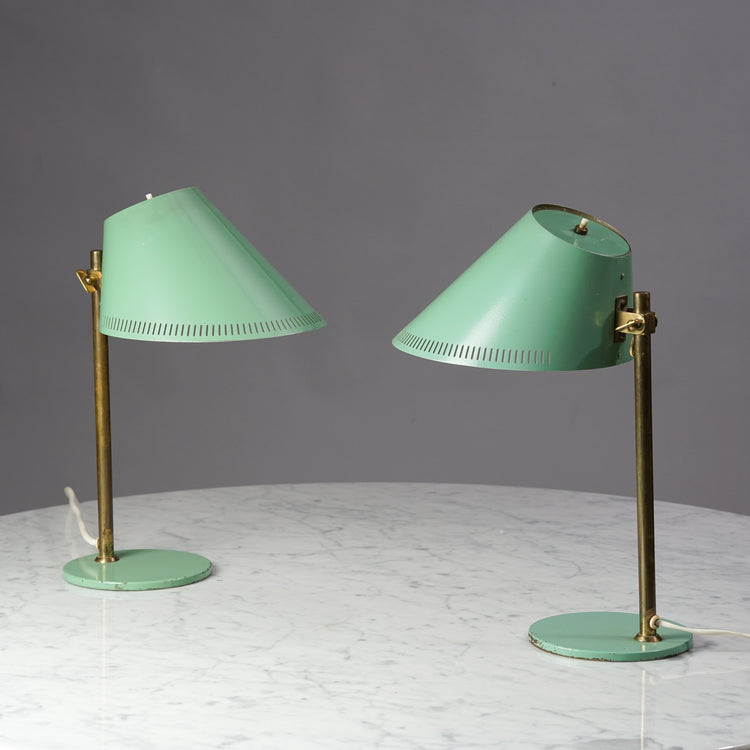 Two identical table lamps with brass frame. The leg and shade are minty green metal.