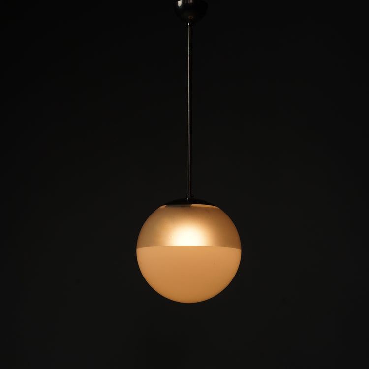 Pendant with metal frame. The lampshade is white ball-shaped glass that has a frosting on the upper part of the glass, making the lampshade two-toned.