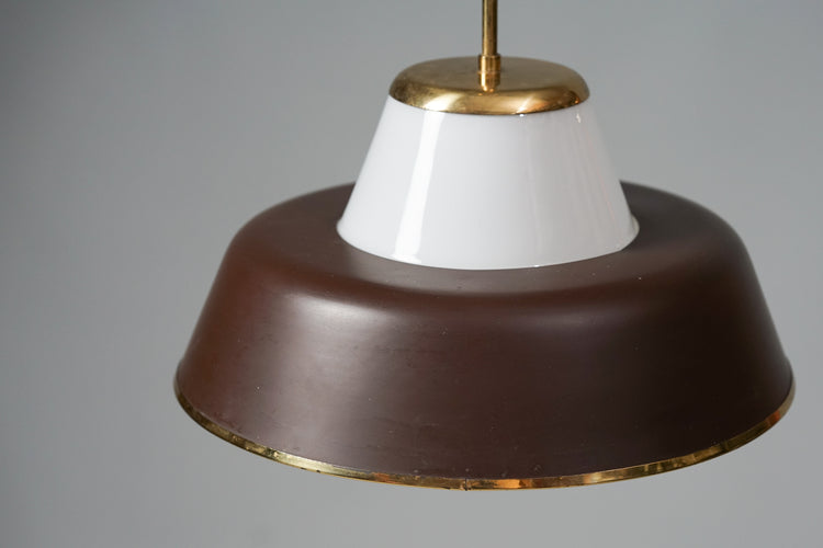 Ceiling lamp made of white cloudy glass with a dark brown metal shade in middle of it. Base of the lamp is made of brass and the lamp has brass detailing on multiple spots.