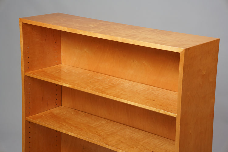 Bookcase made of birch with three shelves.
