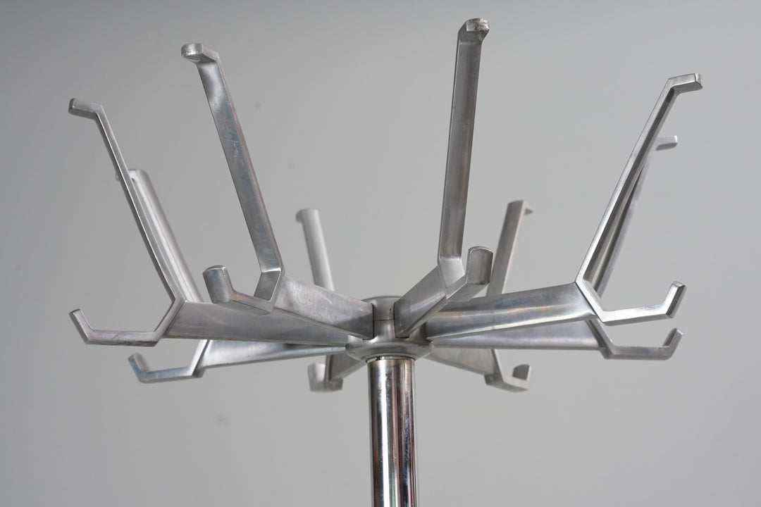 Aluminium/iron coat rack. Eight nails. Circular iron base and aluminium nailer section and frame.