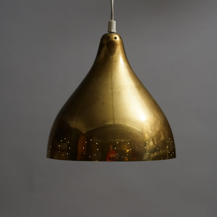Brass lamp with the inside painted white. Has a perforated decoration on the edge.