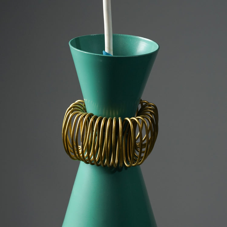 An hourglass-shaped turquoise pendant light with brass ring accents.