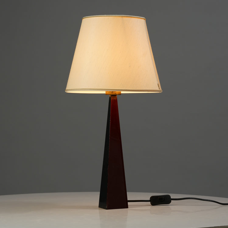 The lamps dark brown base is made of acrylic, the fabric shade having brass detailing on the rim.