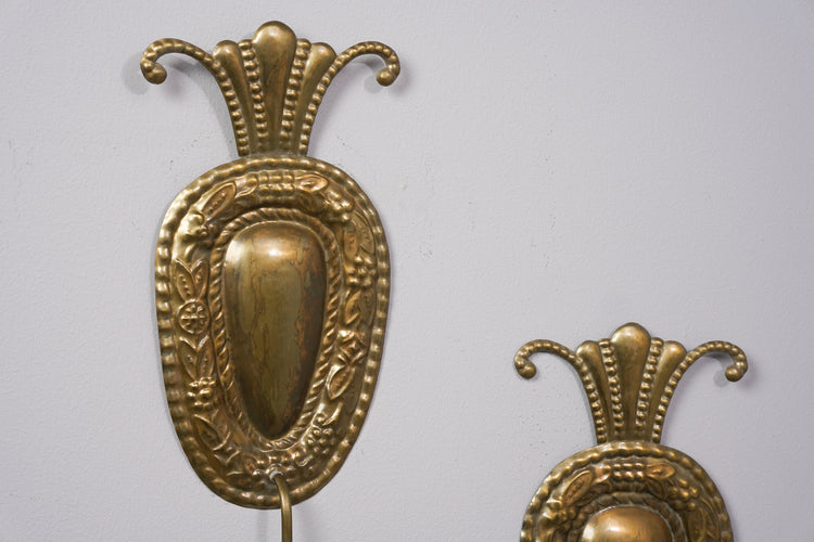 Two identical sconces. Brass wall sconces are the shape of a strawberry. Sconce has a fruit inspired decoration and spot for one candle. 